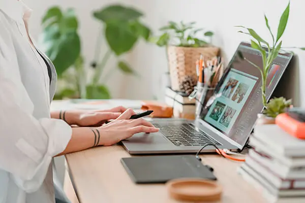 Small business owner working on a laptop to get their business online